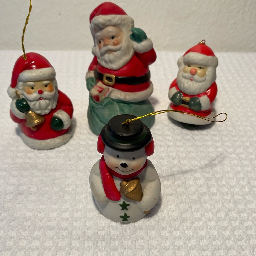 Three Santa Claus and one Snowman Bells